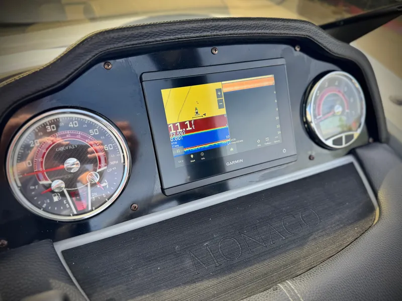 Slide: The Image of Dashboard of 2023 Godfrey Monaco 255 C with Garmin display and gauges. - 28