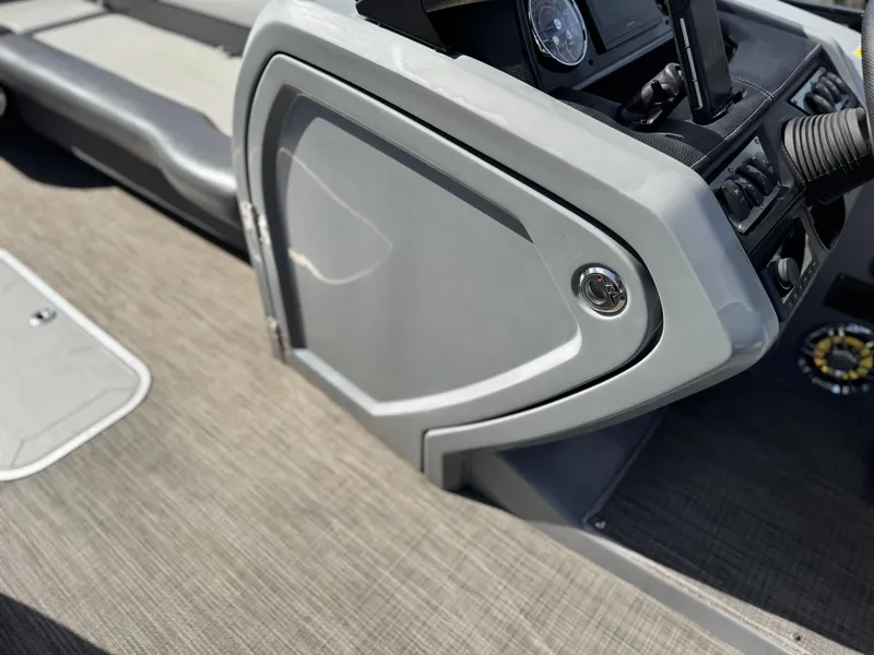 Slide: The Image of 2023 Godfrey Monaco 255 C boat interior with sleek dashboard and modern design. - 34