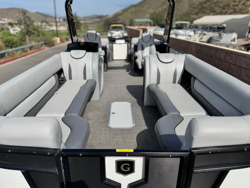 Slide: The Image of 2023 Godfrey Monaco 255 C pontoon boat with spacious seating and modern design. - 8