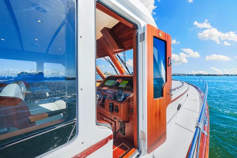 Slide: The Image of 2024 Vicem 62 Classic yacht with wooden interior, cruising on a sunny day. - 10