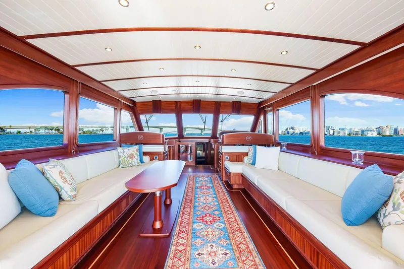 Slide: The Image of Luxurious interior of 2024 Vicem 62 Classic yacht with elegant wood finish and scenic views. - 11