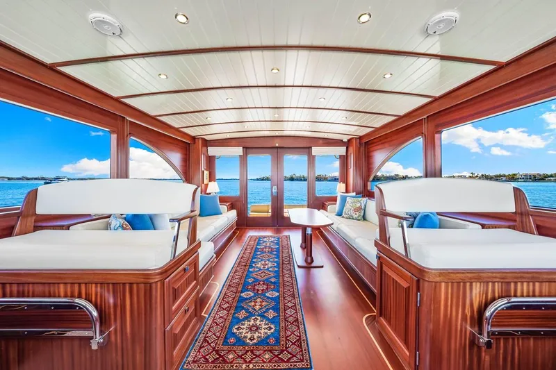 Slide: The Image of Luxurious interior of 2024 Vicem 62 Classic yacht with elegant wood finish and scenic ocean view. - 13