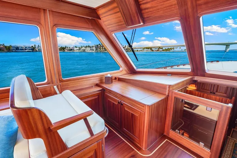 Slide: The Image of Luxurious 2024 Vicem 62 Classic yacht interior with wooden finish and ocean view. - 15