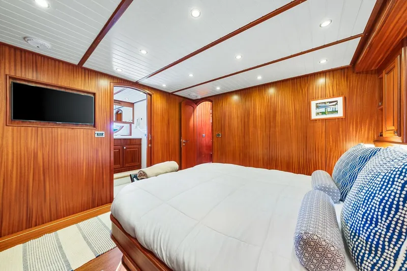 Slide: The Image of Luxurious cabin interior of 2024 Vicem 62 Classic yacht with wood paneling and modern amenities. - 23