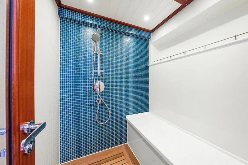Slide: The Image of Shower area in 2024 Vicem 62 Classic yacht with blue mosaic tiles. - 25