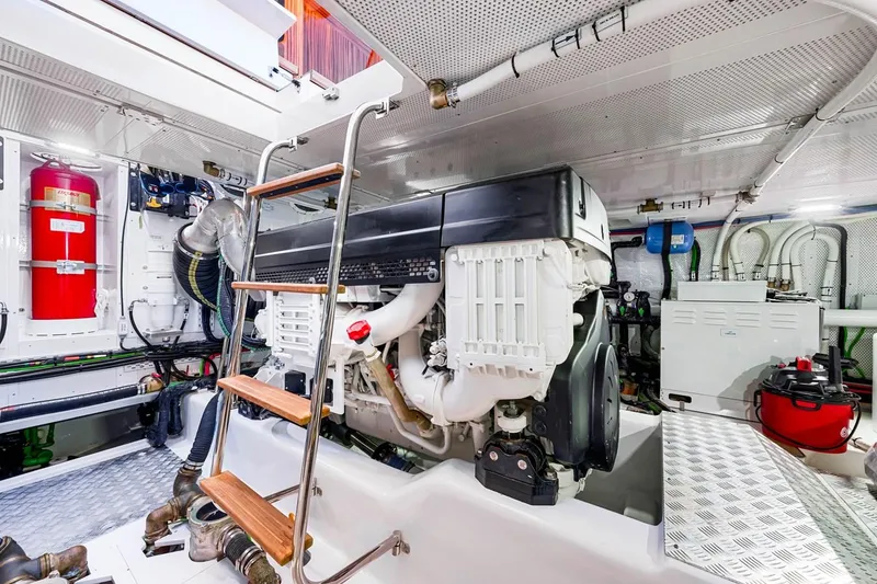 Slide: The Image of Engine room of 2024 Vicem 62 Classic yacht, featuring modern equipment and a ladder. - 33