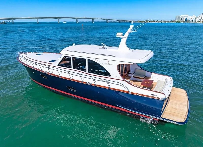 Slide: The Image of 2024 Vicem 62 Classic yacht on blue water with bridge in background. - 36