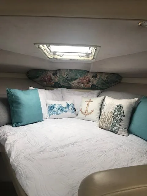 Slide: The Image of Cozy cabin interior of a 1998 Formula 31 PC boat with decorative pillows. - 16