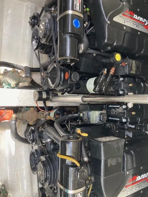 Slide: The Image of Twin engines in a 1998 Formula 31 PC boat, showcasing detailed mechanical components. - 20