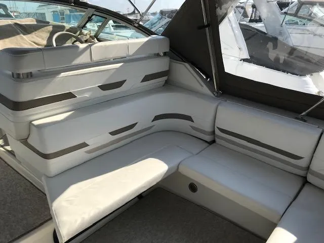 Slide: The Image of 1998 Formula 31 PC boat interior with white cushioned seating and modern design. - 7