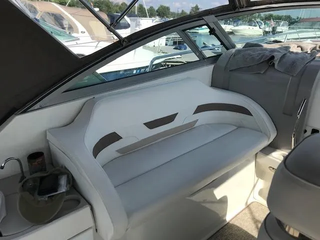 Slide: The Image of 1998 Formula 31 PC boat interior with white seating and modern design. - 8