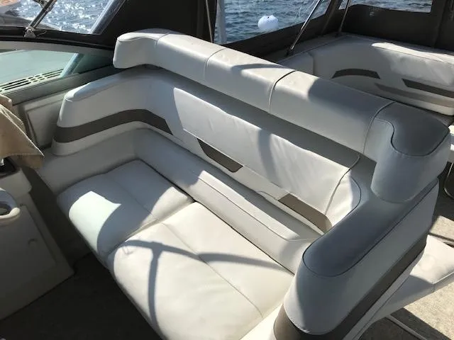 Slide: The Image of 1998 Formula 31 PC boat interior with white and gray seating. - 9