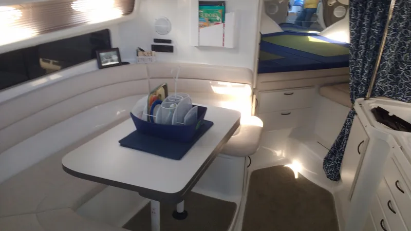 Slide: The Image of Interior of 1996 Doral 350SC boat with cozy seating and dining area. - 11