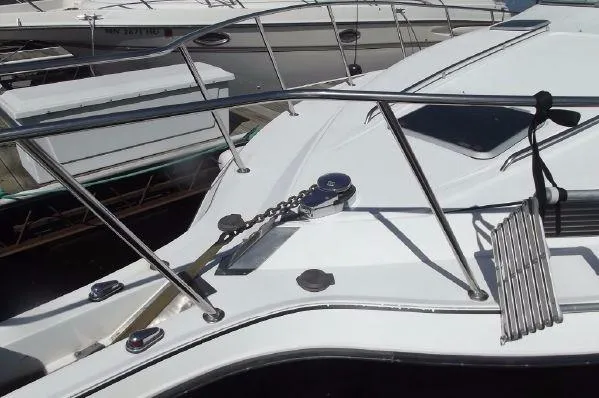 Slide: The Image of 1996 Doral 350SC boat deck with railing and anchor chain. - 4