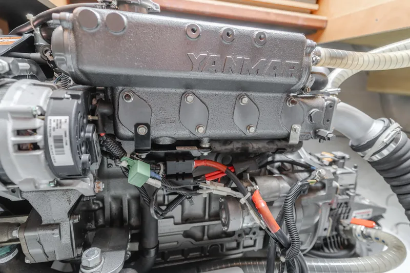 Slide: The Image of Yanmar engine in a 2016 Lagoon 450F catamaran, showcasing detailed mechanical components. - 21