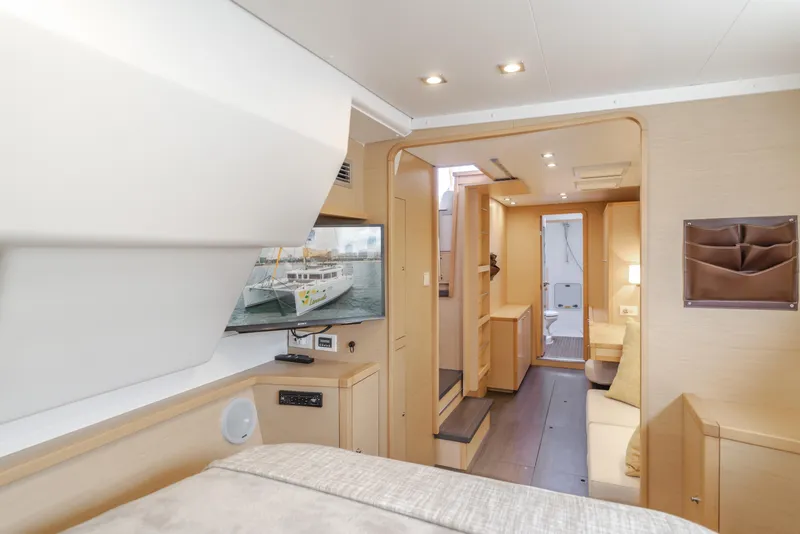 Slide: The Image of Interior of 2016 Lagoon 450F catamaran, featuring modern design and cozy living space. - 32