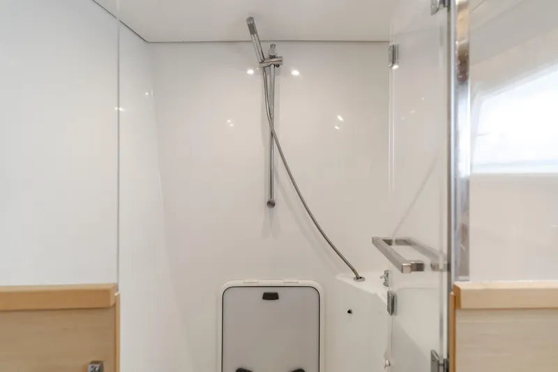 Slide: The Image of Modern shower area in 2016 Lagoon 450F yacht, featuring sleek design and glass door. - 36
