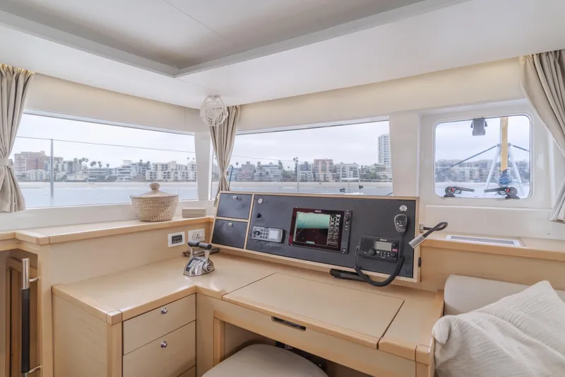 Slide: The Image of Interior of 2016 Lagoon 450F yacht with navigation station and panoramic windows. - 39