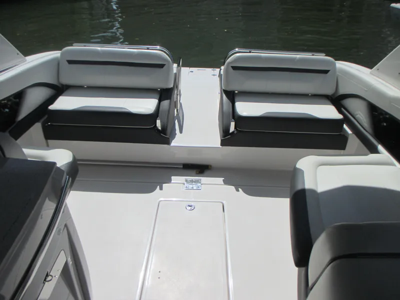 Slide: The Image of 2017 Regal 3200 Bowrider interior with sleek seating and spacious layout on the water. - 12