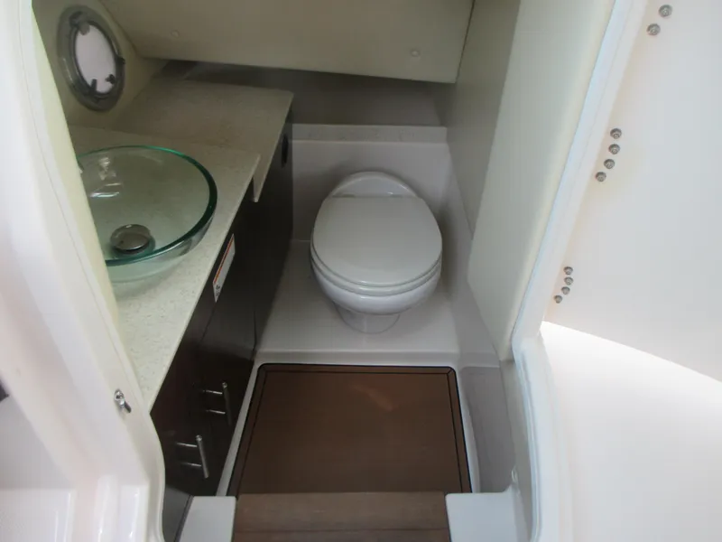 Slide: The Image of 2017 Regal 3200 Bowrider bathroom with modern sink and toilet. - 16