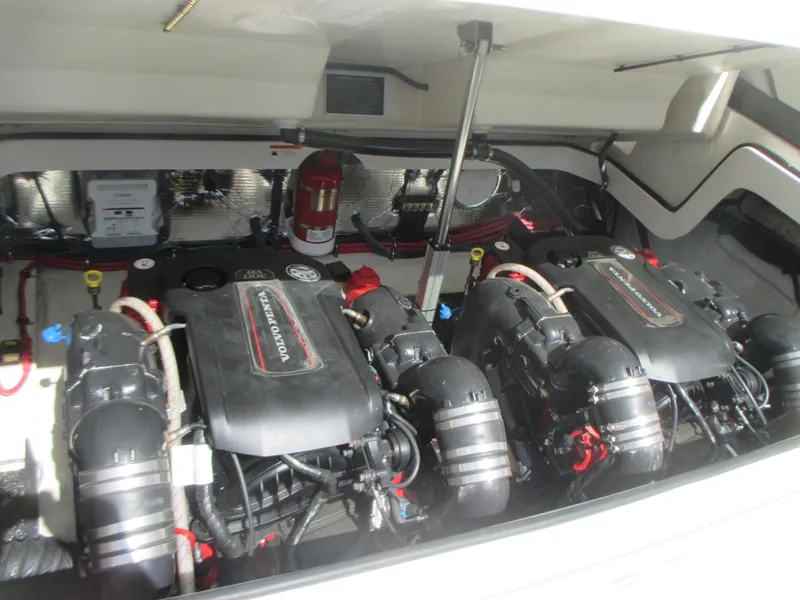 Slide: The Image of 2017 Regal 3200 Bowrider engine compartment with dual engines and fire extinguisher. - 21
