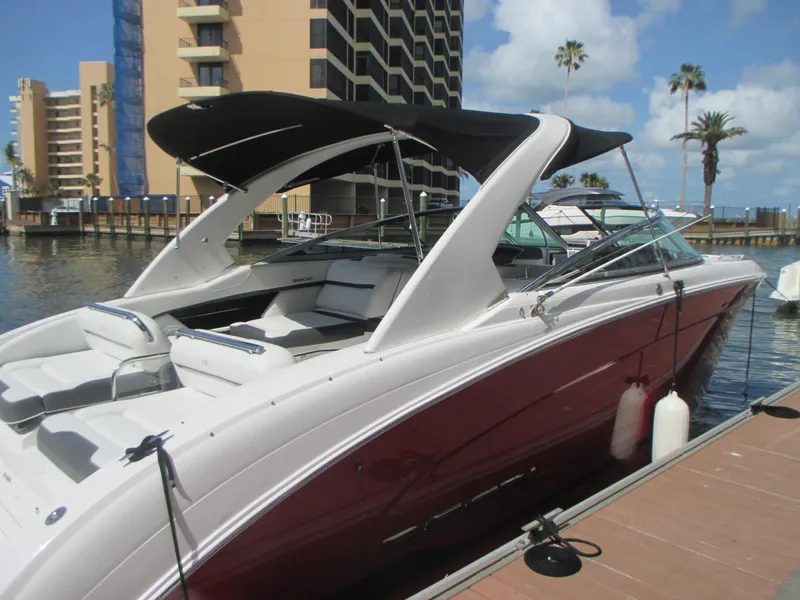 Slide: The Image of 2017 Regal 3200 Bowrider docked, featuring sleek design and spacious seating. - 7