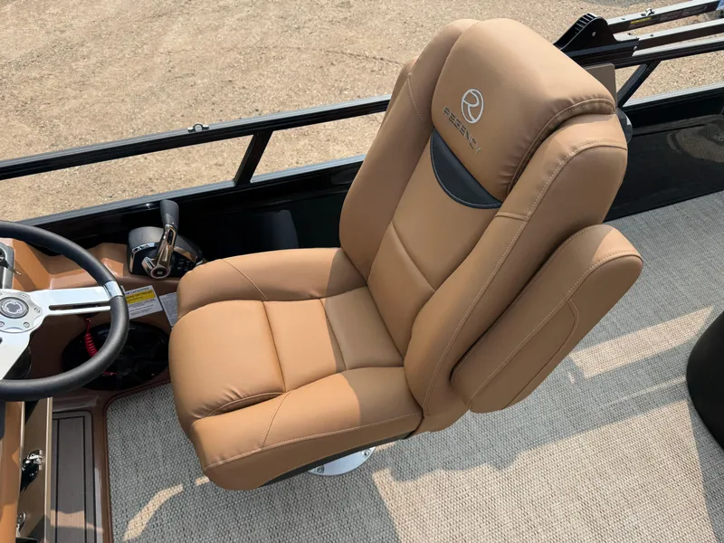 Slide: The Image of Steering console of 2025 Regency 230 LE3 Sport boat with modern controls. - 11