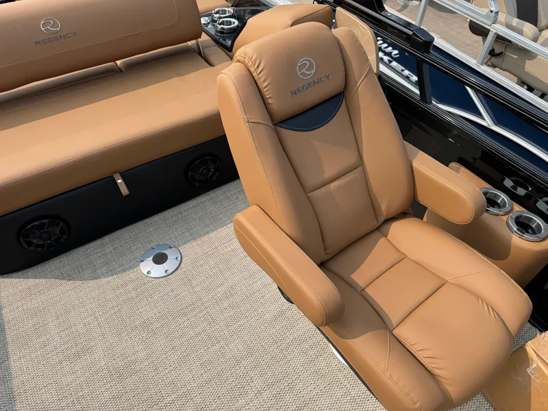 Slide: The Image of Regency 230 LE3 Sport 2025 boat capacity label, 12 persons or 1700 lbs, safety instructions. - 12