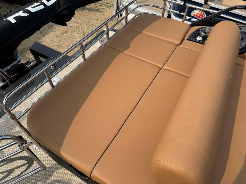 Slide: The Image of Cup holders and controls in 2025 Regency 230 LE3 Sport boat interior. - 15