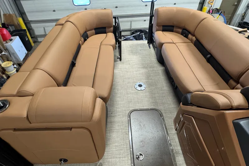 Slide: The Image of 2025 Regency 230 LE3 Sport interior with tan leather seating and spacious layout. - 19