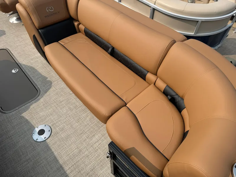 Slide: The Image of Luxurious tan seating in 2025 Regency 230 LE3 Sport boat interior. - 7
