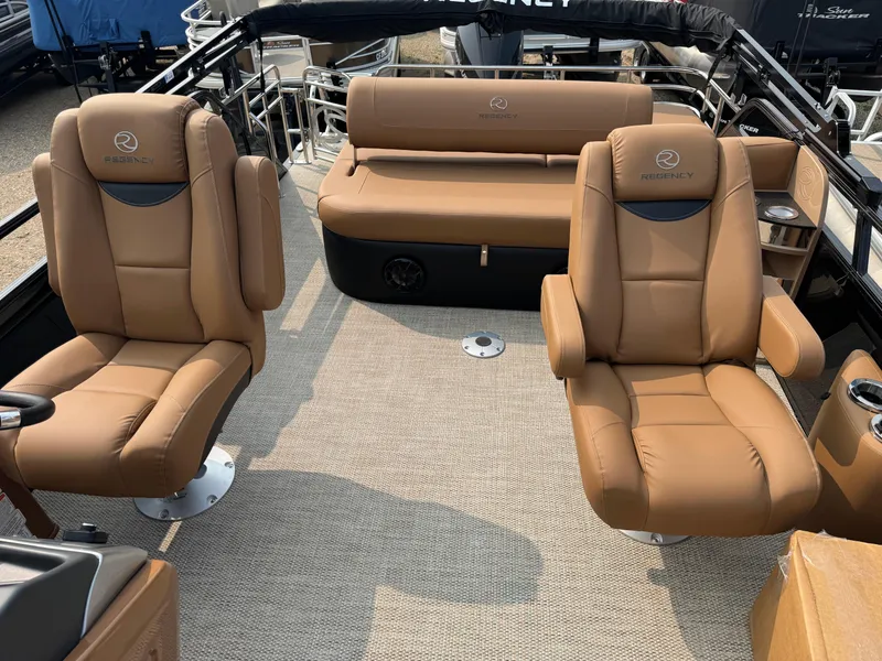 Slide: The Image of Luxurious interior of 2025 Regency 230 LE3 Sport with tan leather seating. - 8