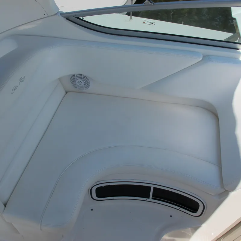 Slide: The Image of Interior seating of a 2007 Sea Ray 280 DA boat, featuring white upholstery. - 15