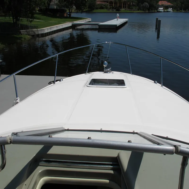 Slide: The Image of 2007 Sea Ray 280 DA boat docked on a calm lake. - 18