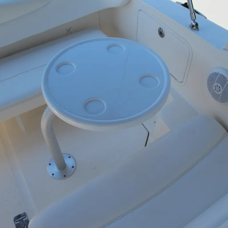 Slide: The Image of 2007 Sea Ray 280 DA boat interior with round table and seating area. - 19