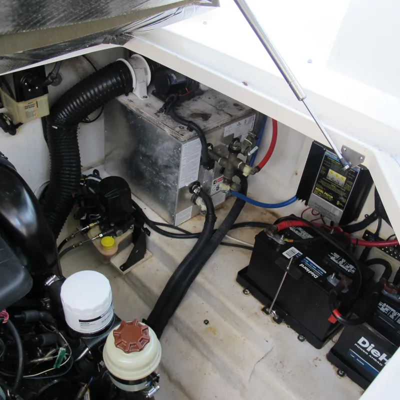 Slide: The Image of Engine compartment of a 2007 Sea Ray 280 DA boat, showing battery and wiring components. - 38