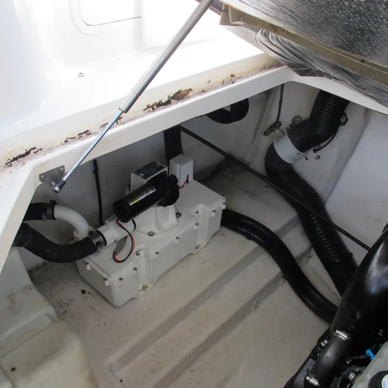 Slide: The Image of Engine compartment of a 2007 Sea Ray 280 DA boat, showing mechanical components and hoses. - 39