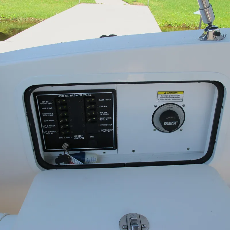 Slide: The Image of 2007 Sea Ray 280 DA boat control panel with breaker switches and ignition. - 7