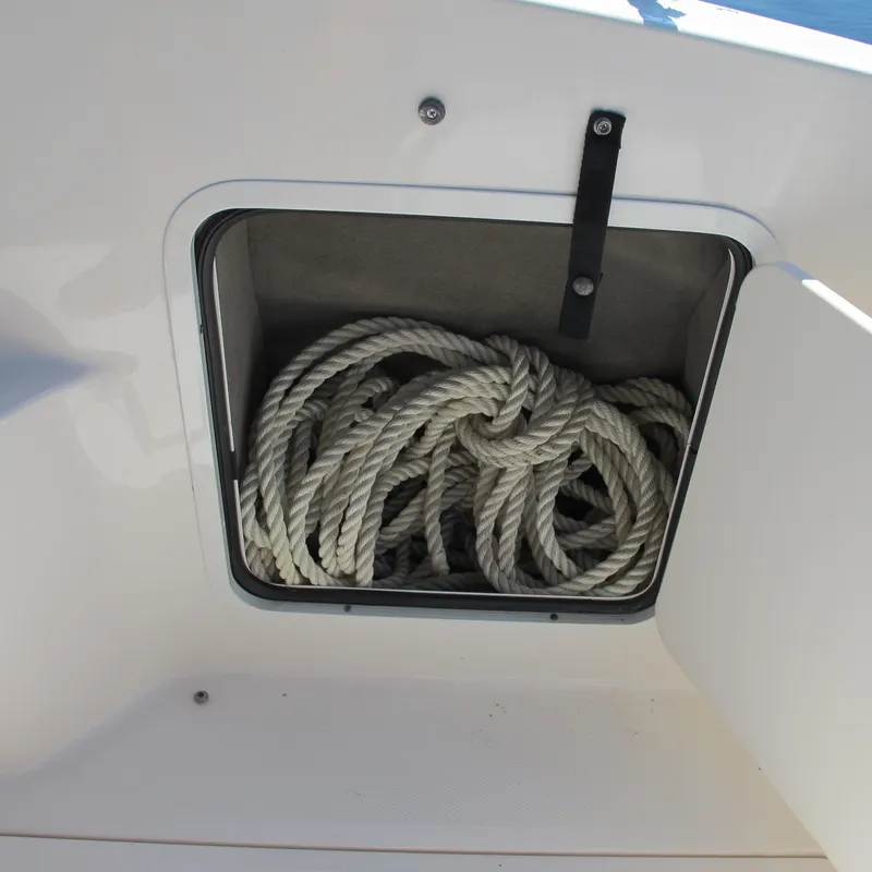 Slide: The Image of Storage compartment with coiled rope on a 2007 Sea Ray 280 DA boat. - 8