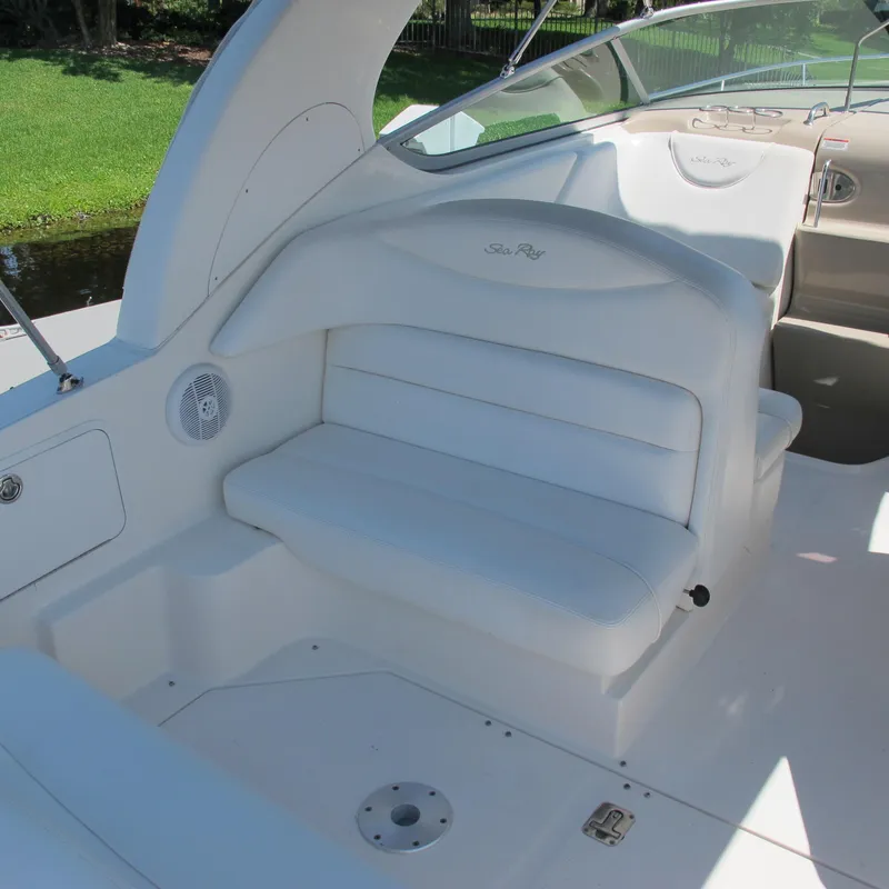 Slide: The Image of 2007 Sea Ray 280 DA boat interior with white seating and speaker. - 9