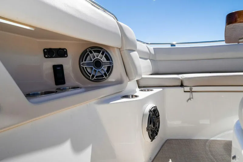 Slide: The Image of 2019 Boston Whaler 350 Realm interior with speakers and seating, showcasing luxury design. - 15
