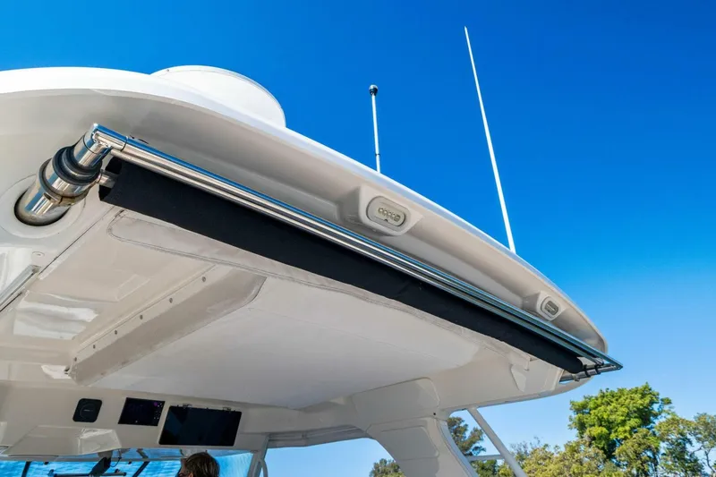 Slide: The Image of 2019 Boston Whaler 350 Realm boat canopy against clear blue sky. - 22