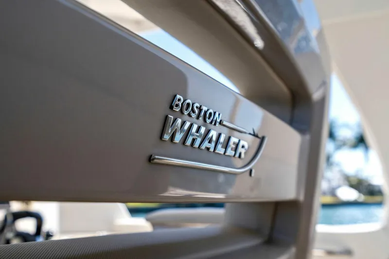 Slide: The Image of 2019 Boston Whaler 350 Realm logo on boat exterior, close-up view. - 23