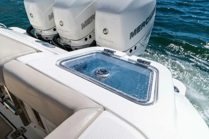 Slide: The Image of Boston Whaler 350 Realm 2019 boat with Mercury engines and livewell on the water. - 28