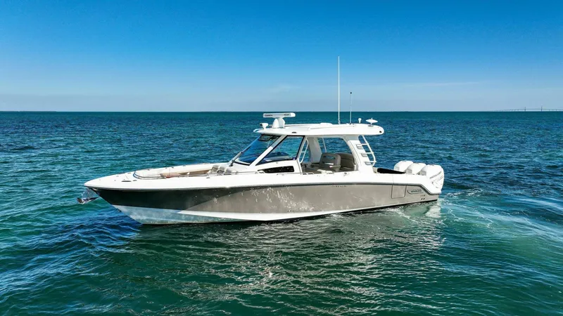 Slide: The Image of 2019 Boston Whaler 350 Realm boat cruising on open water. - 33