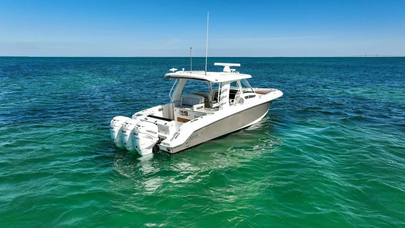 Slide: The Image of 2019 Boston Whaler 350 Realm boat on clear blue ocean water. - 41