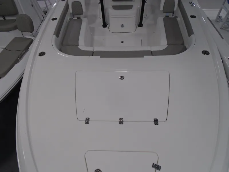 Slide: The Image of 2025 Caymas 281 HB boat interior with spacious seating and storage compartments. - 15