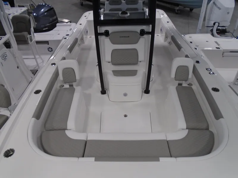 Slide: The Image of 2025 Caymas 281 HB boat interior with cushioned seating and modern design. - 16