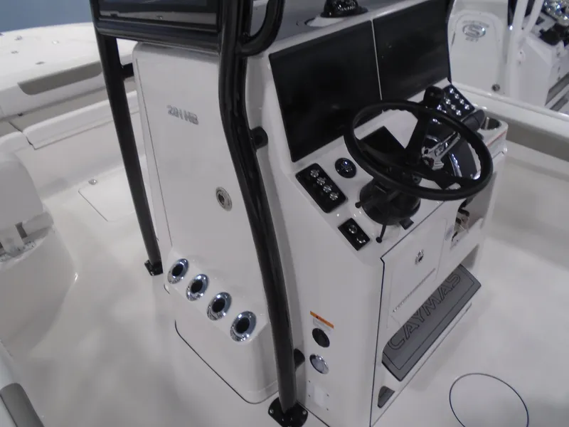 Slide: The Image of 2025 Caymas 281 HB boat console with steering wheel and control panels. - 20