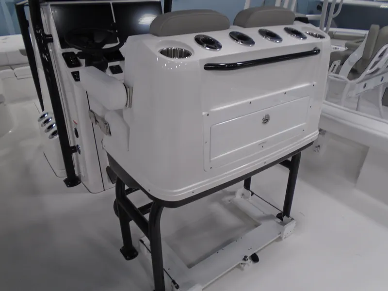 Slide: The Image of 2025 Caymas 281 HB boat console with seating and storage compartments. - 25